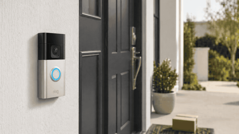 Ring Video Doorbell 2nd Gen mounted beside a modern front door with a package on the doorstep.